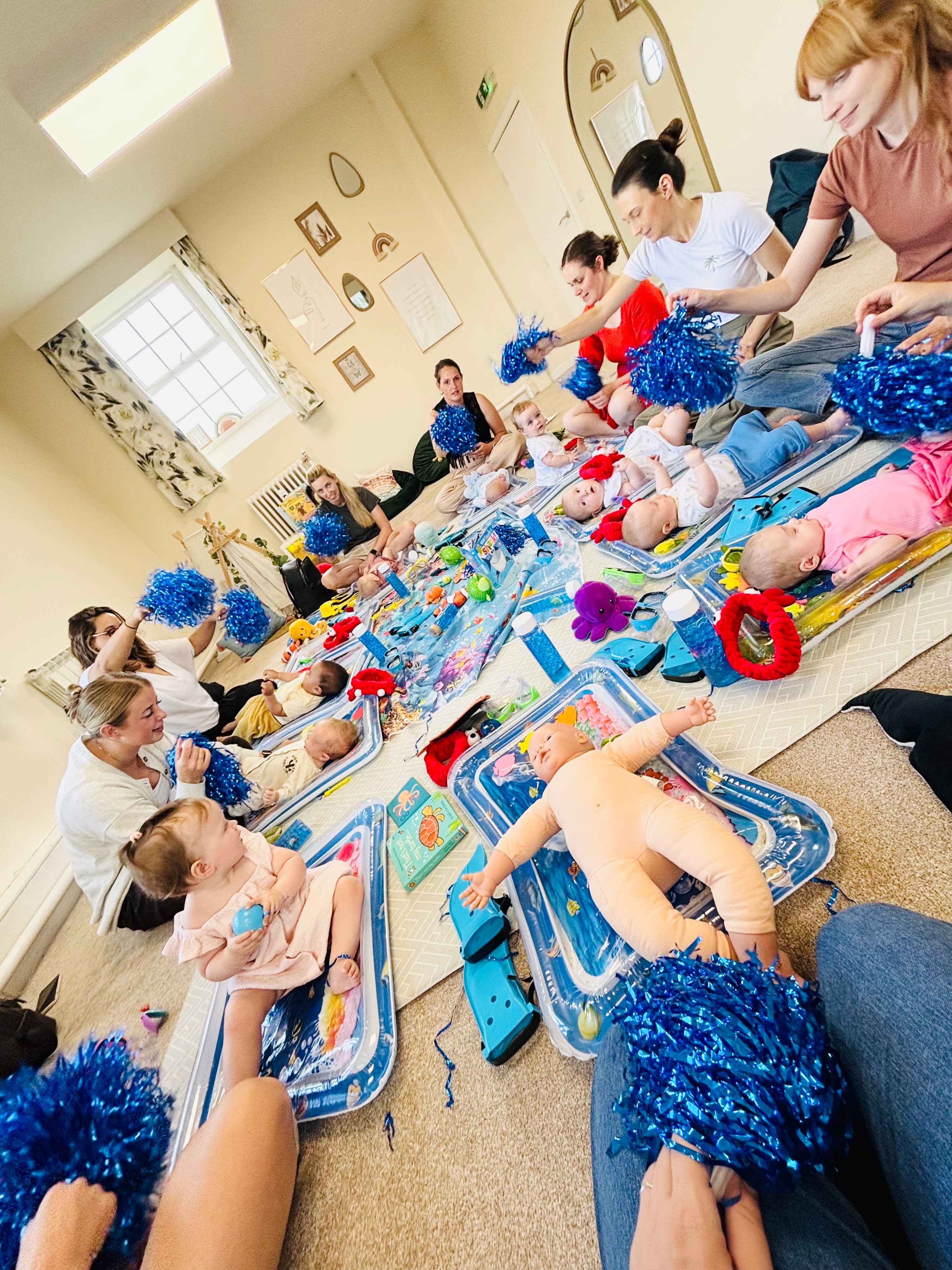 Babies enjoying a sensory water mat session at Buddha Bears